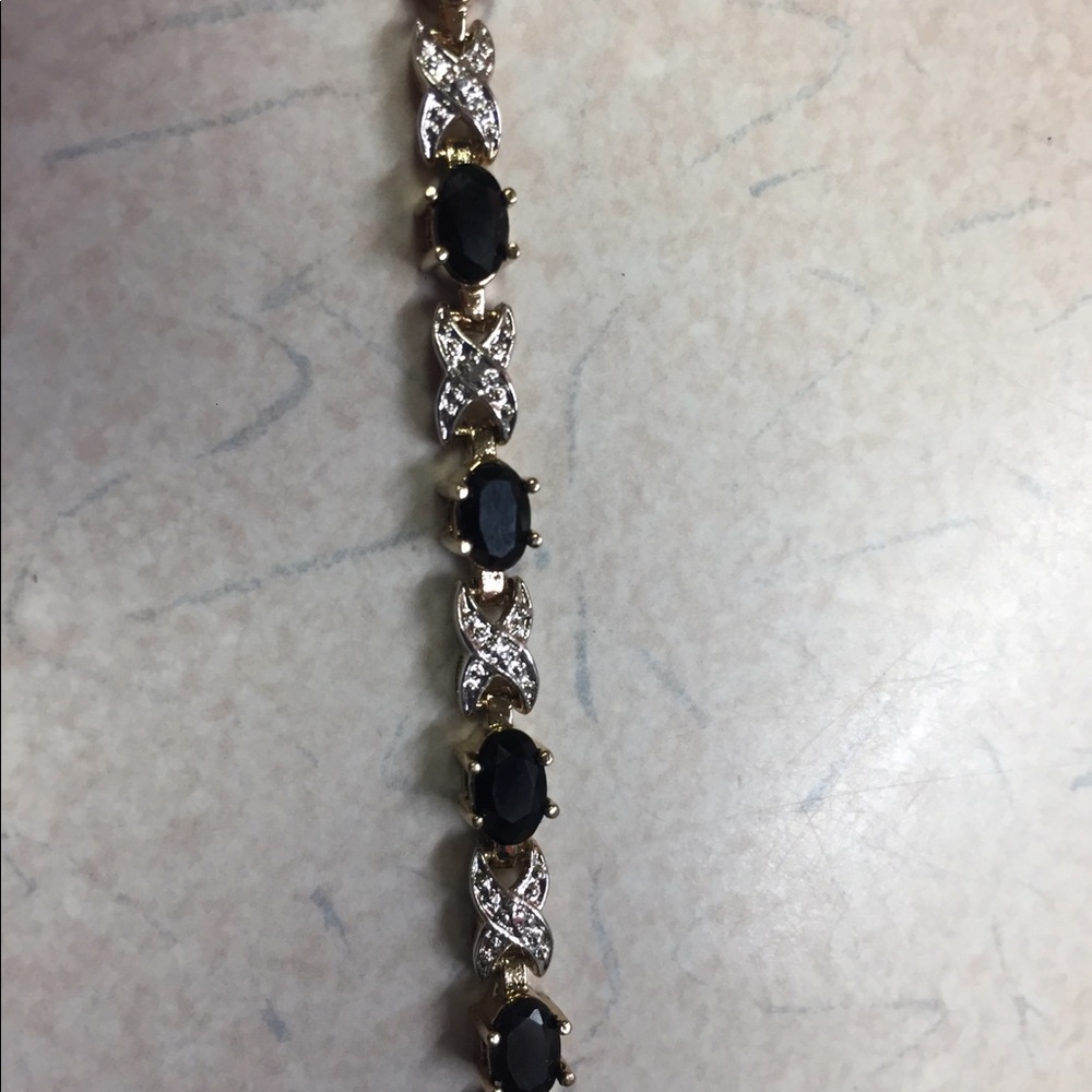 Gold bracelet with diamonds and black onyx 7.25”